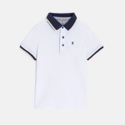 Boy's white cotton piqué polo shirt with short sleeves