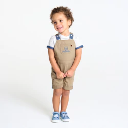 Baby boy's short beige overalls with a white T-shirt