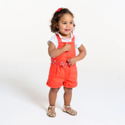 Baby girl's soft orange cotton short overalls.