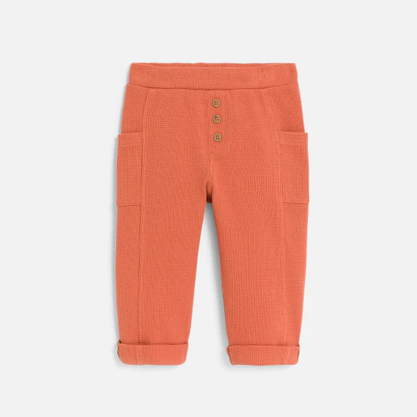 Baby boy's terracotta patterned cotton trousers