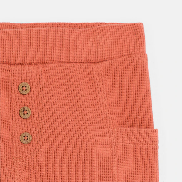 Baby boy's terracotta patterned cotton trousers