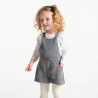 Baby girl's warm patterned overall-shorts and grey T-shirt